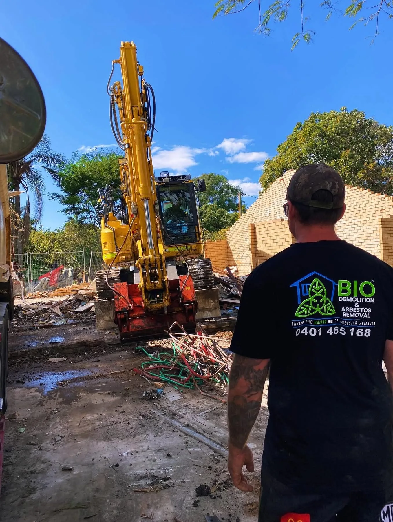Excavator carrying out expert demolition services on a Gold Coast site
